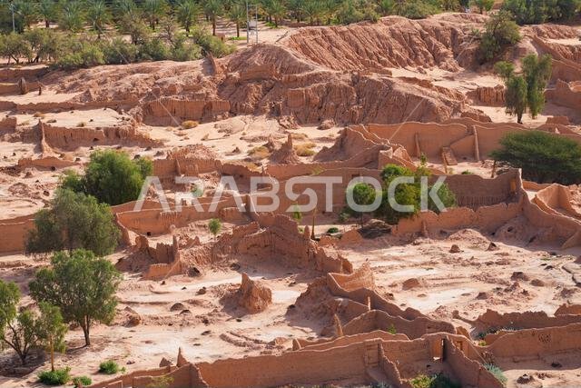 Aerial view of the restored historical mudbrick walls and oasis palm trees in AlUla, Saudi Arabia