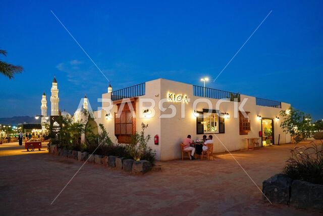 Modern restaurant illuminated at blue hour near Quba Mosque in the holy city of Madinah, Saudi Arabia