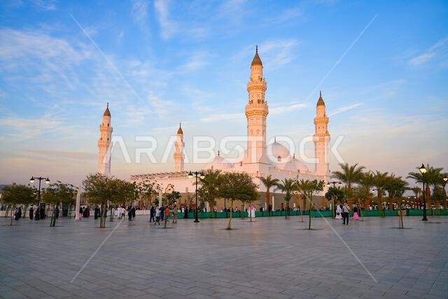 Historic white Quba Mosque and its four minarets as seen from the public Qubaa Square in Madinah, Saudi Arabia
