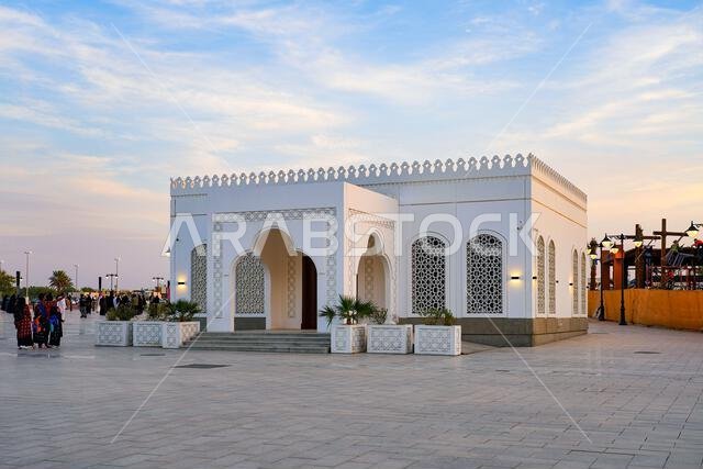 Traditional white islamic pavilion with geometric arabesque windows near the Quba Mosque in Madinah, Saudi Arabia