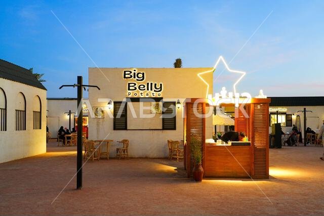 Modern restaurant illuminated at blue hour near Quba Mosque in the holy city of Madinah, Saudi Arabia