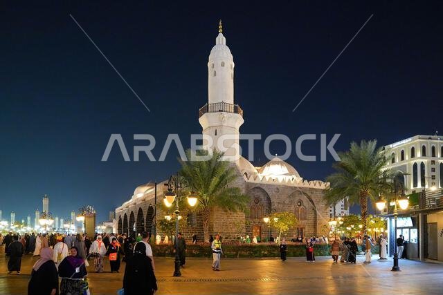 The historic Al-Ghamama Mosque architecture with its white domes at night in Madinah, Saudi Arabia