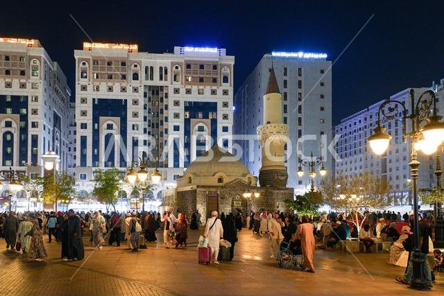 Night view of the historic Abu Bakr As-Siddiq Mosque and bustling plaza in Madinah, Saudi Arabia Night view of the historic Abu Bakr As-Siddiq Mosque and bustling plaza in Madinah, Saudi Arabia