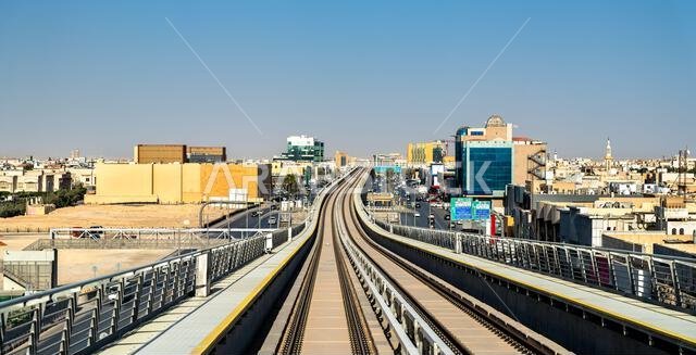 Elevated view of the Riyadh Metro rail system and urban development along King Abdullah Road in Riyadh, Saudi Arabia.