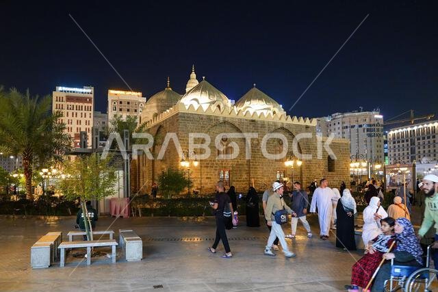 The historic Al-Ghamama Mosque architecture with its white domes at night in Madinah, Saudi Arabia