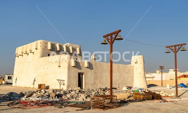 The historic Mehaires Palace under restoration near Al Hofuf, Al Ahsa, Saudi Arabia, featuring traditional clay architecture under a clear blue sky. The historic Mehaires Palace under restoration near Al Hofuf, Al Ahsa, Saudi Arabia, featuring traditional clay architecture under a clear blue sky.