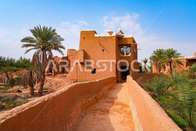 Walkway winding through the mud brick houses of the heritage village of Ushaiqer, Saudi Arabia