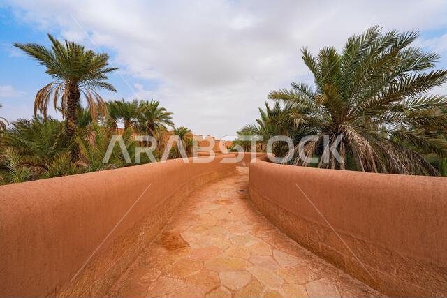 Walkway winding through the mud brick houses of the heritage village of Ushaiqer, Saudi Arabia