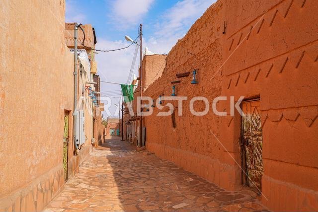 Paved street flanked with mud brick houses in the heritage village of Ushaiqer, Saudi Arabia