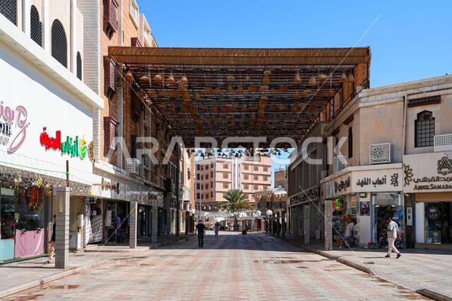 Wide pedestrian shopping street with a large overhead shade structure in Al Balad of Taif, Saudi Arabia Wide pedestrian shopping street with a large overhead shade structure in Al Balad of Taif, Saudi Arabia