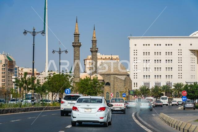 Traffic on the avenue heading towards the historic Al Anbariya Masjid in Madinah, Saudi Arabia
