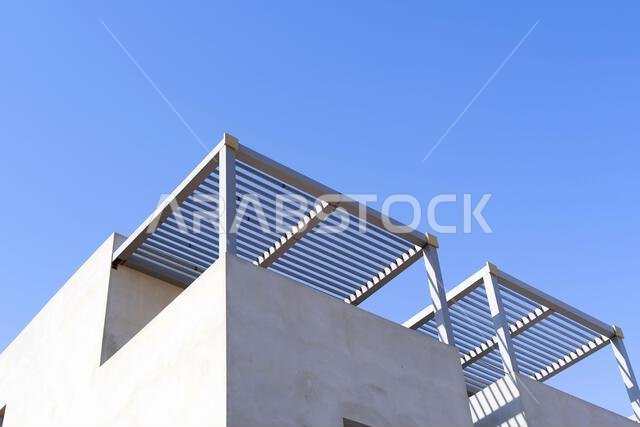 New house under construction in Riyadh, Saudi Arabia, showing cement walls, unfinished structure, and early building stages of a residential property.
