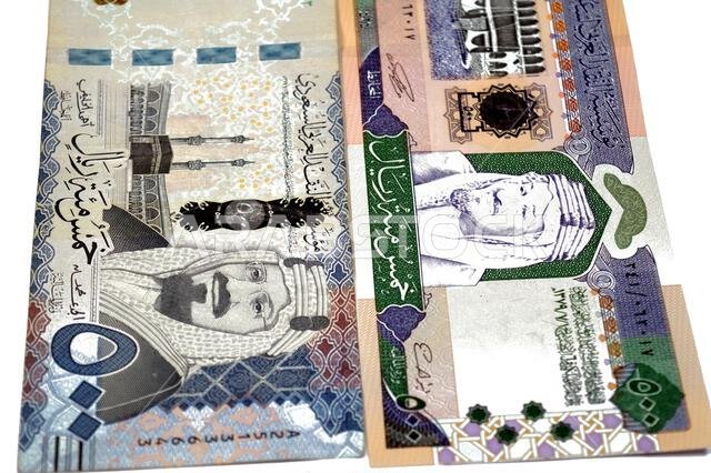 obverse sides of old and new 500 SAR five hundred Saudi riyals cash money banknote bill, features The Kaaba Ka'aba, inside the Great Mosque of Mecca,