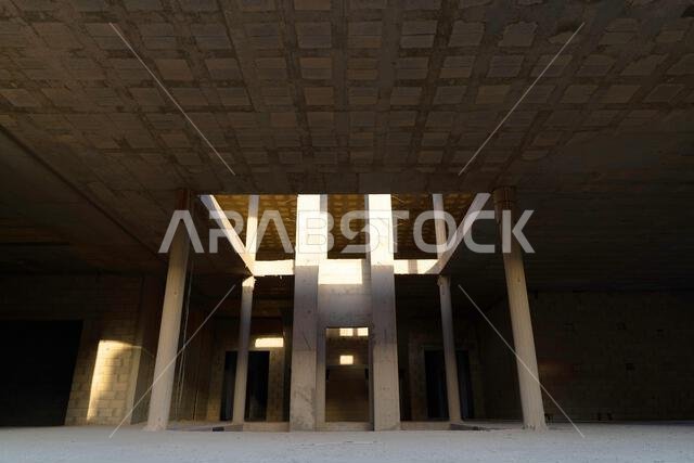 New house under construction in Riyadh, Saudi Arabia, showing cement walls, unfinished structure, and early building stages of a residential property.