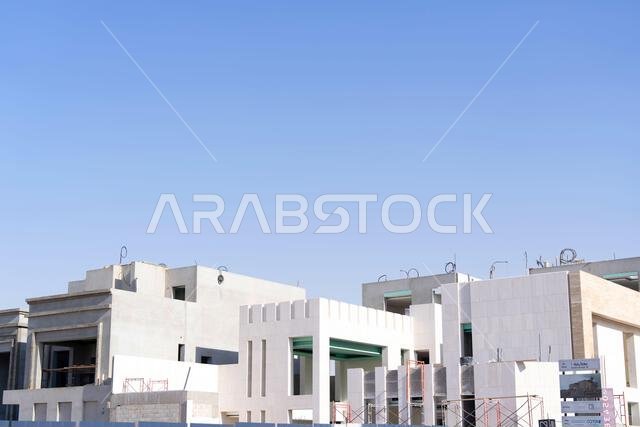 New house under construction in Riyadh, Saudi Arabia, showing cement walls, unfinished structure, and early building stages of a residential property. New house under construction in Riyadh, Saudi Arabia, showing cement walls, unfinished structure, and early building stages of a residential property.
