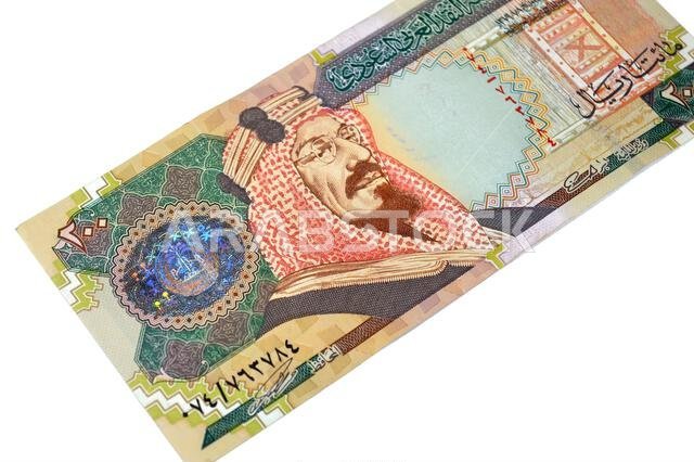 The obverse side of 200 SAR two hundred Saudi Arabia riyal cash money banknote bill, features King Abdulaziz Al Saud, picture of the door of Al-Masmak