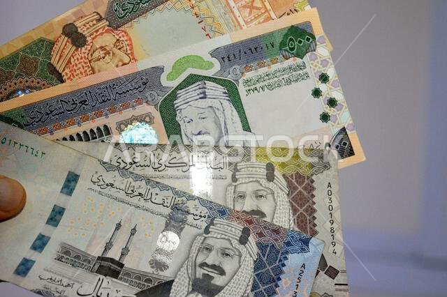 The Saudi Arabian riyals SAR banknotes cash money bills, of different times, eras and values, from old vintage retro King Fahd times till king Salman The Saudi Arabian riyals SAR banknotes cash money bills, of different times, eras and values, from old vintage retro King Fahd times till king Salman