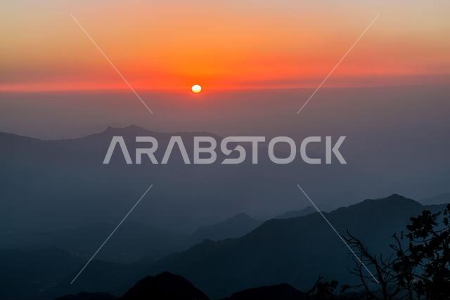 A landscape picture of the sunset from to the tops of the Al-Soudah Mountains, southern Saudi Arabia