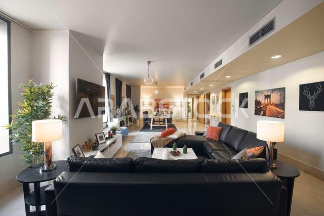 Interior view of a furnished apartment in Riyadh, Saudi Arabia, showing modern furniture, decor, and comfortable living space.