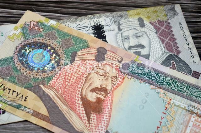 The obverse sides of old and new 200 SAR two hundred Saudi Arabia riyal cash money banknote bill, features King Abdulaziz Al Saud, Saudi Arabian money
