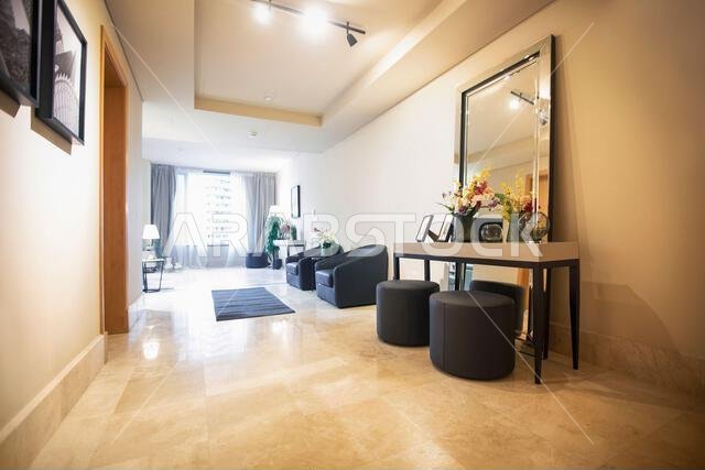 Interior view of a furnished apartment in Riyadh, Saudi Arabia, showing modern furniture, decor, and comfortable living space.