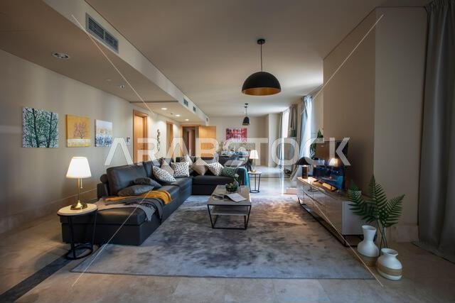 Interior view of a furnished apartment in Riyadh, Saudi Arabia, showing modern furniture, decor, and comfortable living space.
