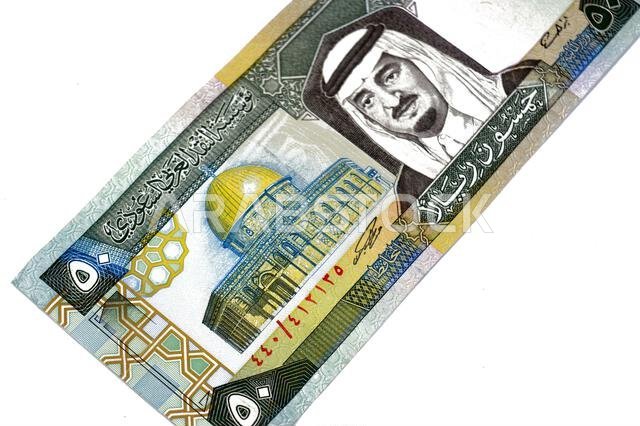 the obverse side of 50 SAR fifty Saudi Arabian riyals cash money banknotes bill, features a portrait of king Fahd Bin AbdulAziz Al Saud and Dome of th the obverse side of 50 SAR fifty Saudi Arabian riyals cash money banknotes bill, features a portrait of king Fahd Bin AbdulAziz Al Saud and Dome of th