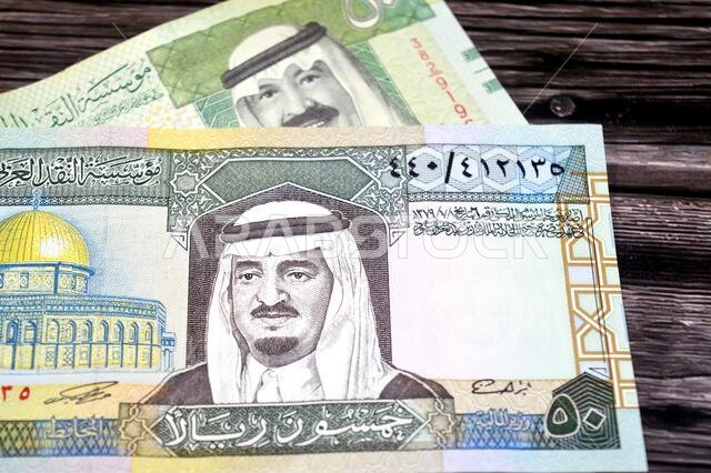 obverse sides of 50 SAR fifty Saudi Arabian riyals cash money banknotes bills, features king Fahd and king Abdullah Bin AbdulAziz Al Saud and Dome of obverse sides of 50 SAR fifty Saudi Arabian riyals cash money banknotes bills, features king Fahd and king Abdullah Bin AbdulAziz Al Saud and Dome of