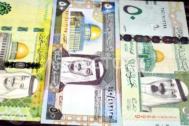 Front sides of 50 SAR fifty Saudi Arabian riyals cash money banknotes bills, features king Fahd, King Salman and king Abdullah Bin AbdulAziz Al Saud a