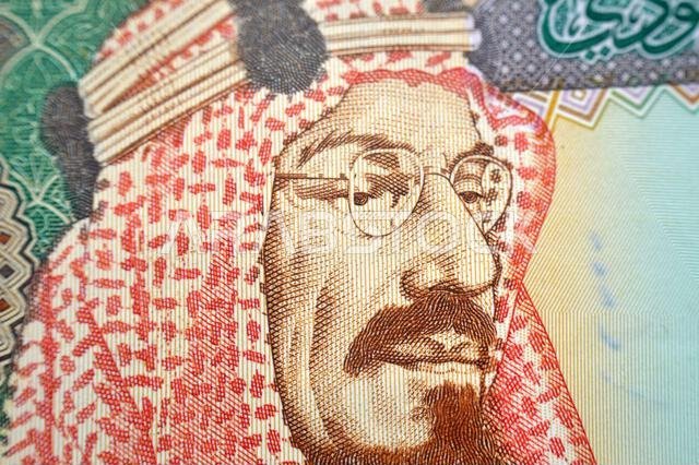 King Abdulaziz Al Saud from obverse side of 200 SAR two hundred Saudi Arabia riyal cash money banknote bill, also features, picture of the door of Al-