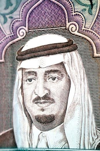 a portrait of king Fahd Bin AbdulAziz Al Saud from the obverse side of 5 SAR five Saudi Arabian riyals cash money banknote bill, also features Dhows,