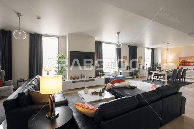 Interior view of a furnished apartment in Riyadh, Saudi Arabia, showing modern furniture, decor, and comfortable living space.