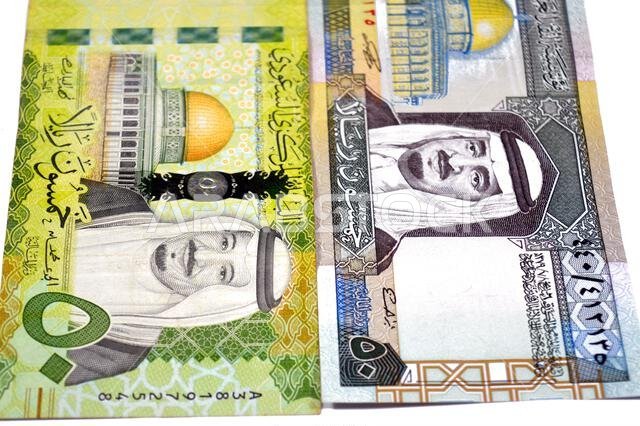 the obverse sides of 50 SAR fifty Saudi Arabian riyals cash money banknotes bills, features king Fahd and king Salman Bin AbdulAziz Al Saud and Dome o the obverse sides of 50 SAR fifty Saudi Arabian riyals cash money banknotes bills, features king Fahd and king Salman Bin AbdulAziz Al Saud and Dome o
