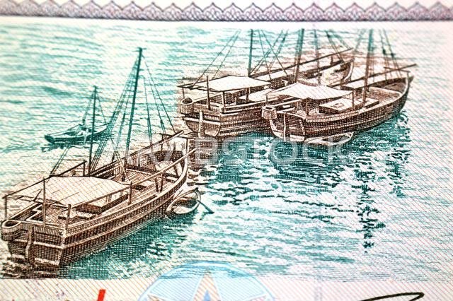 Dhows ships from the obverse side of 5 SAR five Saudi Arabian riyals cash money banknote bill, also features a portrait of king Fahd Bin AbdulAziz Al