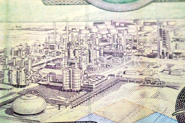 Oil refinery from the reverse side of 5 SAR five Saudi Arabian riyals cash money banknote bill, old vintage retro Saudi money