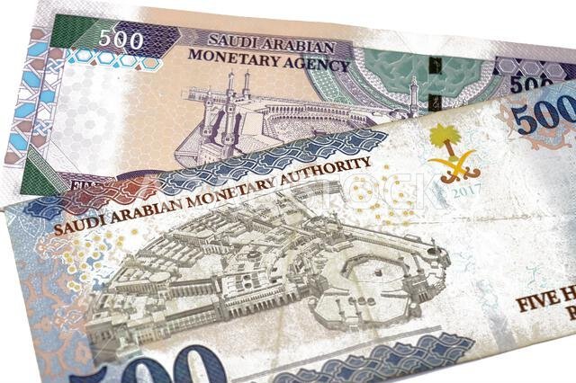 The reverse sides of old and new 500 SAR five hundred Saudi riyals cash money banknote bill, features the Courtyard of The Holy great Mosque in Mecca,