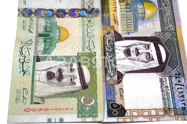 obverse sides of 50 SAR fifty Saudi Arabian riyals cash money banknotes bills, features king Fahd and king Abdullah Bin AbdulAziz Al Saud and Dome of obverse sides of 50 SAR fifty Saudi Arabian riyals cash money banknotes bills, features king Fahd and king Abdullah Bin AbdulAziz Al Saud and Dome of