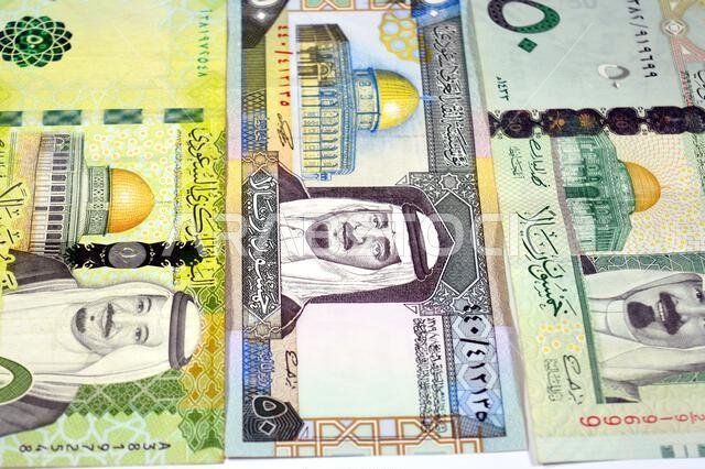 Front sides of 50 SAR fifty Saudi Arabian riyals cash money banknotes bills, features king Fahd, King Salman and king Abdullah Bin AbdulAziz Al Saud a Front sides of 50 SAR fifty Saudi Arabian riyals cash money banknotes bills, features king Fahd, King Salman and king Abdullah Bin AbdulAziz Al Saud a