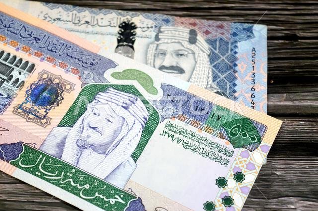 The obverse sides of old and new 500 SAR five hundred Saudi riyals cash money banknote bill, features The Kaaba Ka'aba, inside the Great Mosque of Mec