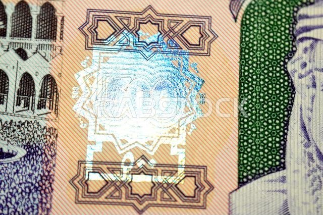 closeup of obverse side of 500 SAR five hundred Saudi riyals cash money banknote bill, features The Kaaba Ka'aba, inside the Great Mosque of Mecca, Ki
