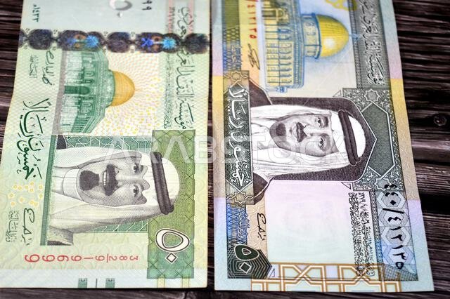 obverse sides of 50 SAR fifty Saudi Arabian riyals cash money banknotes bills, features king Fahd and king Abdullah Bin AbdulAziz Al Saud and Dome of obverse sides of 50 SAR fifty Saudi Arabian riyals cash money banknotes bills, features king Fahd and king Abdullah Bin AbdulAziz Al Saud and Dome of