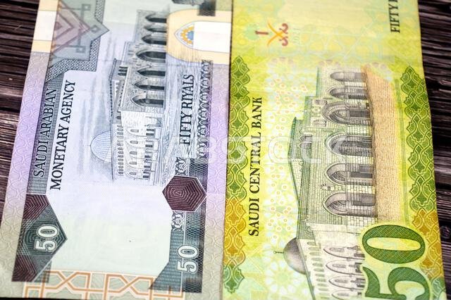 the reverse sides of old and new 50 SAR fifty Saudi Arabian riyals cash money banknotes bill, features Al-Aqsha Mosque in Jerusalem, Saudi Arabia mone the reverse sides of old and new 50 SAR fifty Saudi Arabian riyals cash money banknotes bill, features Al-Aqsha Mosque in Jerusalem, Saudi Arabia mone