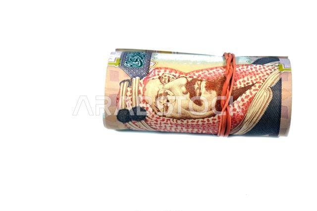 200 SAR two hundred Saudi Arabia riyal cash money banknote bills roll wrapped in a rubber, features King Abdulaziz Al Saud, picture of the door of Al-