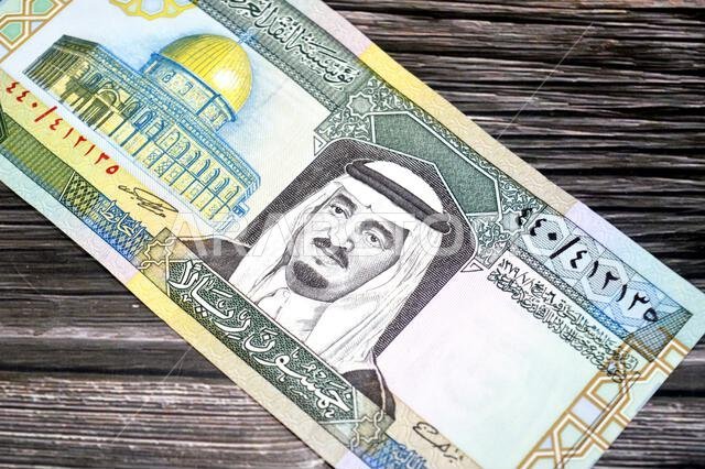 the obverse side of 50 SAR fifty Saudi Arabian riyals cash money banknotes bill, features a portrait of king Fahd Bin AbdulAziz Al Saud and Dome of th the obverse side of 50 SAR fifty Saudi Arabian riyals cash money banknotes bill, features a portrait of king Fahd Bin AbdulAziz Al Saud and Dome of th