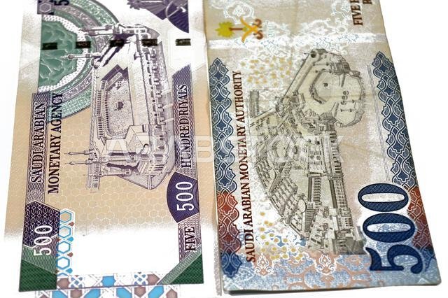 reverse sides of old and new 500 SAR five hundred Saudi riyals cash money banknote bill, features the Courtyard of The Holy great Mosque in Mecca, The