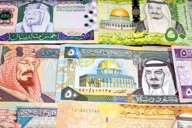 Saudi Arabian riyals SAR banknotes cash money bills, of different times, eras and values, from old vintage retro King Fahd times till king Salman time