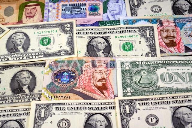 USD American dollars and Saudi Arabian riyals SAR banknotes cash money bills, of different times, eras and values, Saudi Arabia riyals money and Ameri
