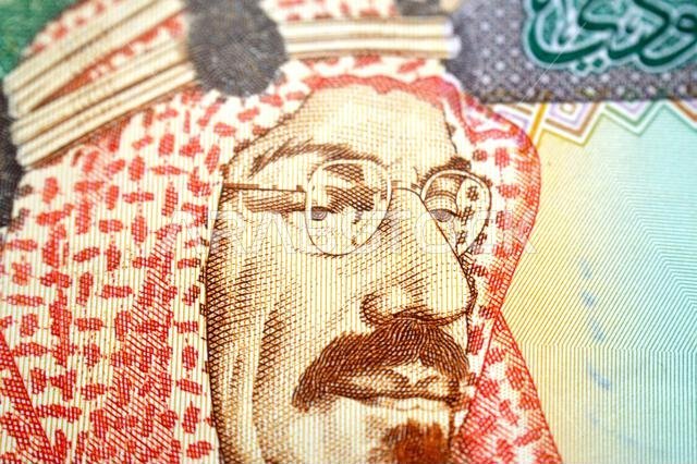 King Abdulaziz Al Saud from obverse side of 200 SAR two hundred Saudi Arabia riyal cash money banknote bill, also features, picture of the door of Al-