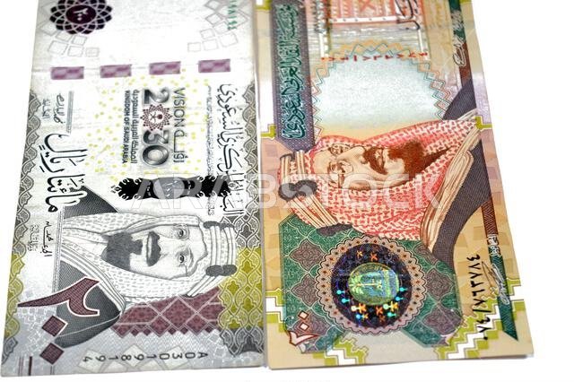 The obverse sides of old and new 200 SAR two hundred Saudi Arabia riyal cash money banknote bill, features King Abdulaziz Al Saud, Saudi Arabian money The obverse sides of old and new 200 SAR two hundred Saudi Arabia riyal cash money banknote bill, features King Abdulaziz Al Saud, Saudi Arabian money