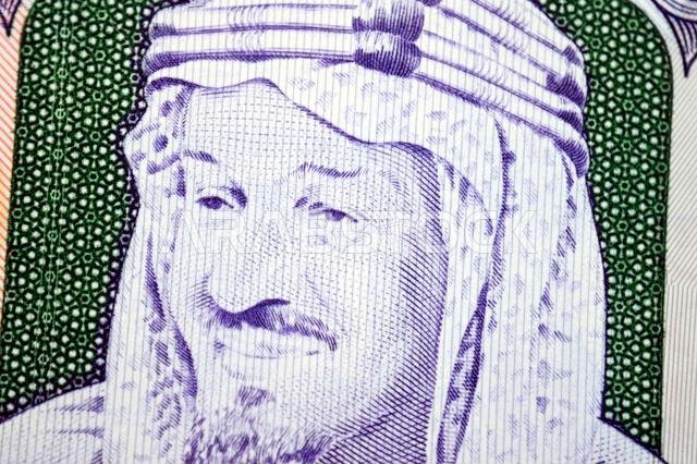 A portrait of King Abdulaziz Bin Abdulrahman Al Saud from obverse side of 500 SAR five hundred Saudi riyals cash money banknote bill, also features Th